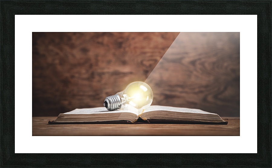 Light bulb on the book. Knowledge Creative Wi  Framed Print Print