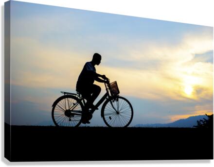 Children enjoy ride bicycle during sunset  Impression sur toile